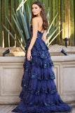 One shoulder tulle sequin A-Line gown with sheer corset bodice and ruffle high slit